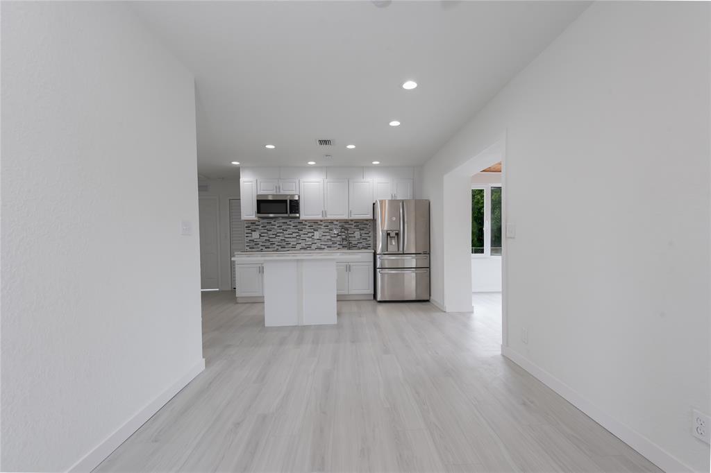 713 Southwest 4th Court Hallandale Beach, FL 33009 - Photo 32 of 38 a view of kitchen with wooden floor