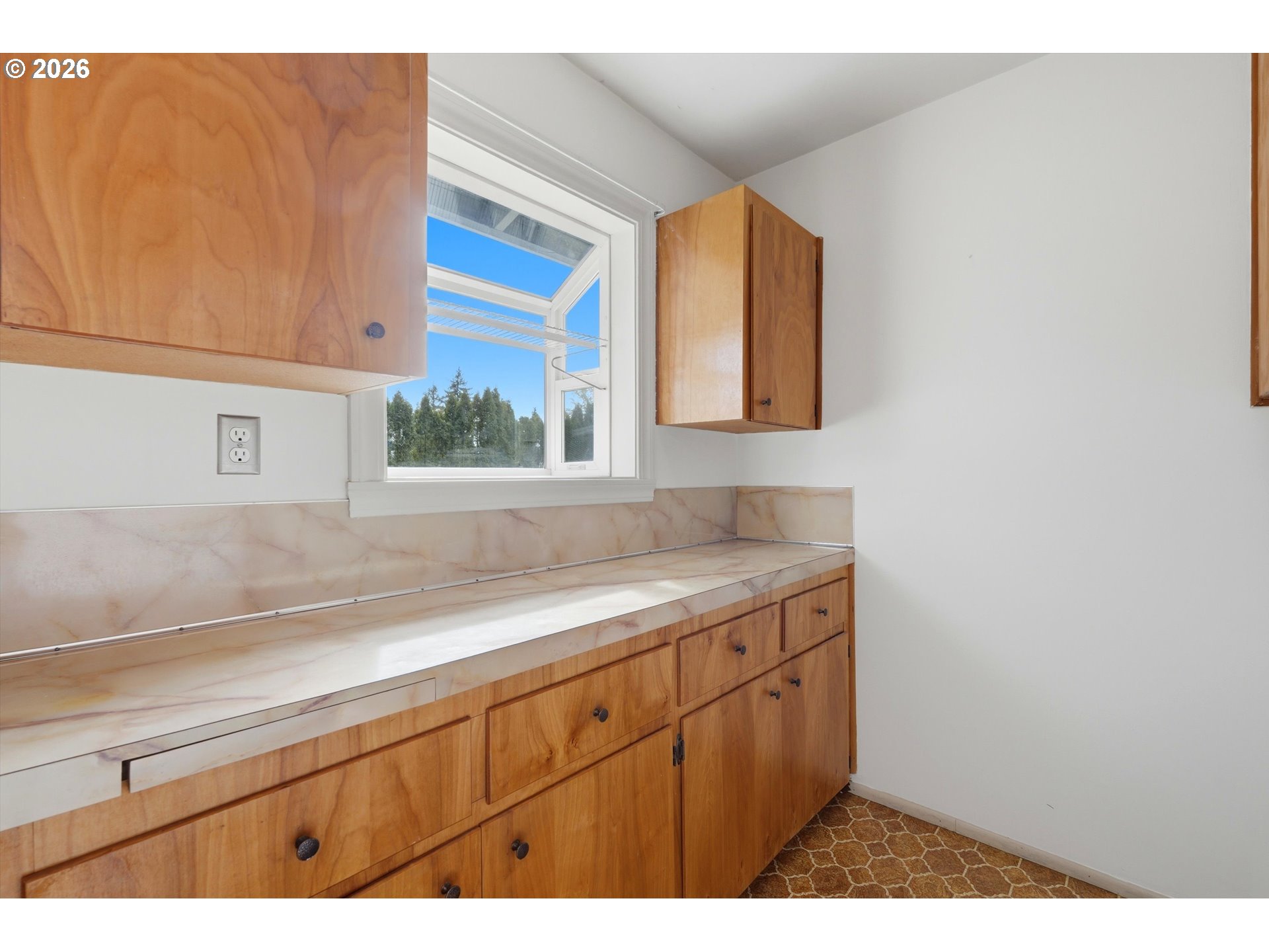 16706 Southeast Ankeny Street Portland, OR 97233 - Photo 18 of 43 a kitchen with a sink cabinets and a window