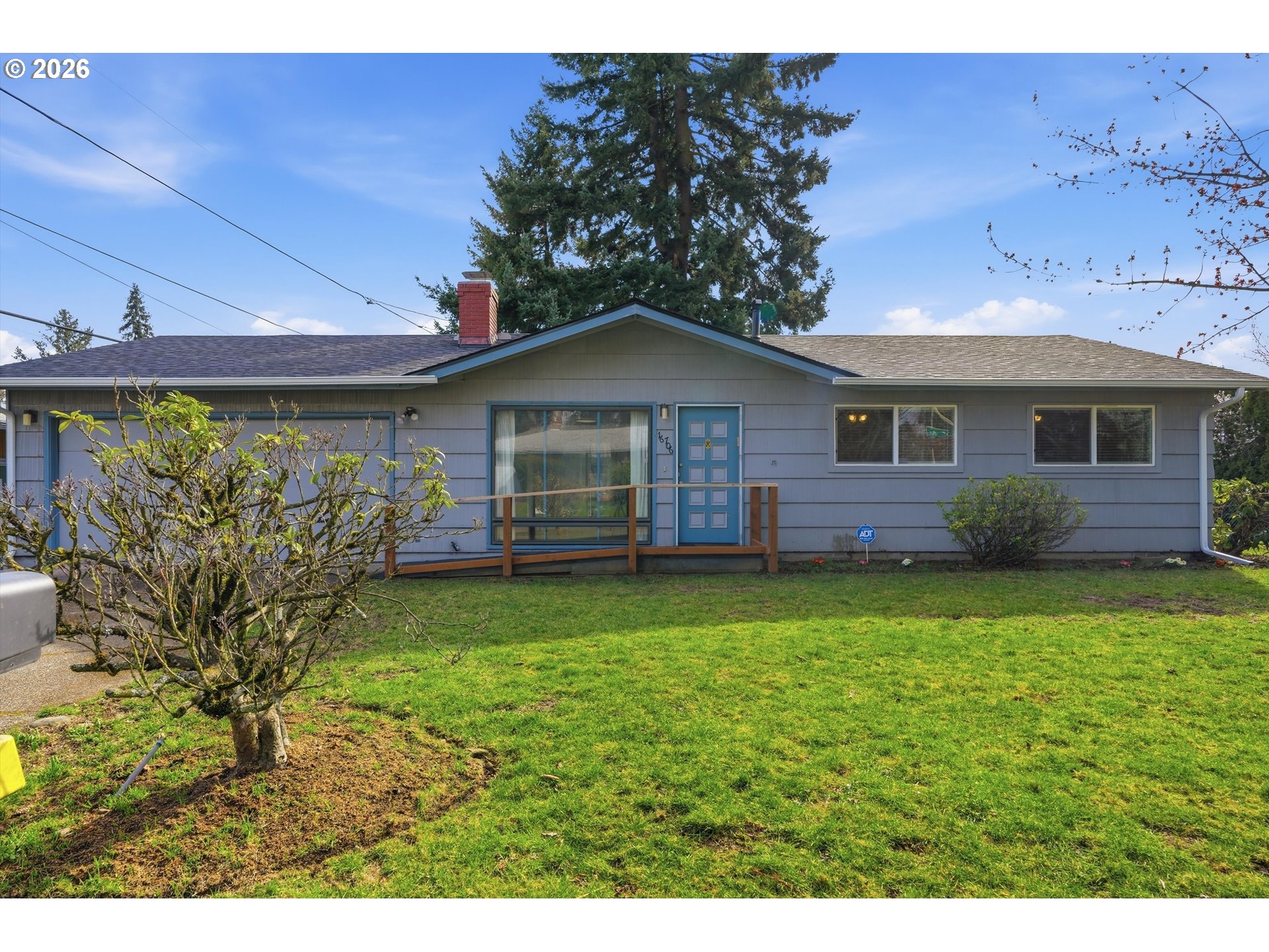 16706 Southeast Ankeny Street Portland, OR 97233 - Photo 2 of 43 a front view of a house with garden