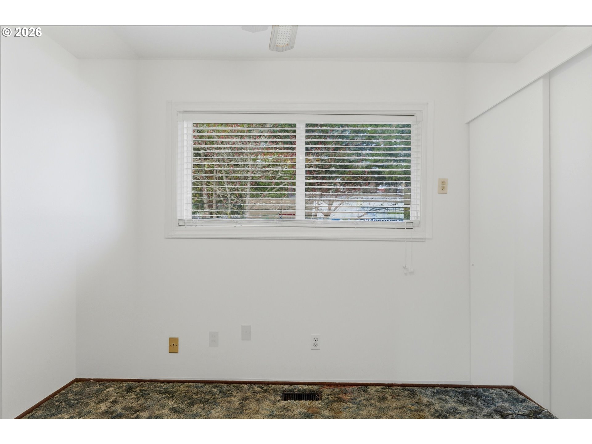 16706 Southeast Ankeny Street Portland, OR 97233 - Photo 27 of 43 a view of an empty room with wooden floor
