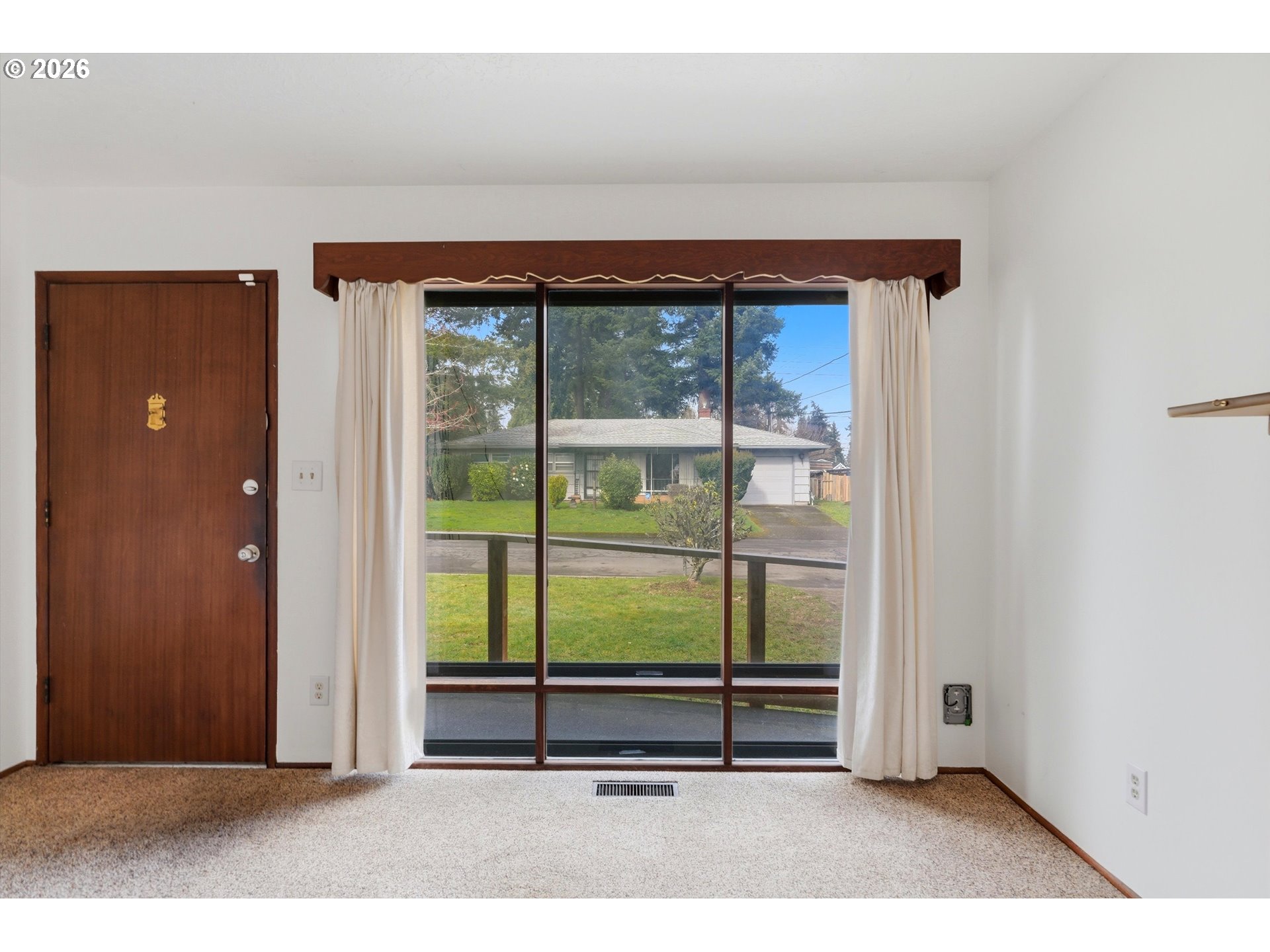 16706 Southeast Ankeny Street Portland, OR 97233 - Photo 4 of 43 an empty room with window