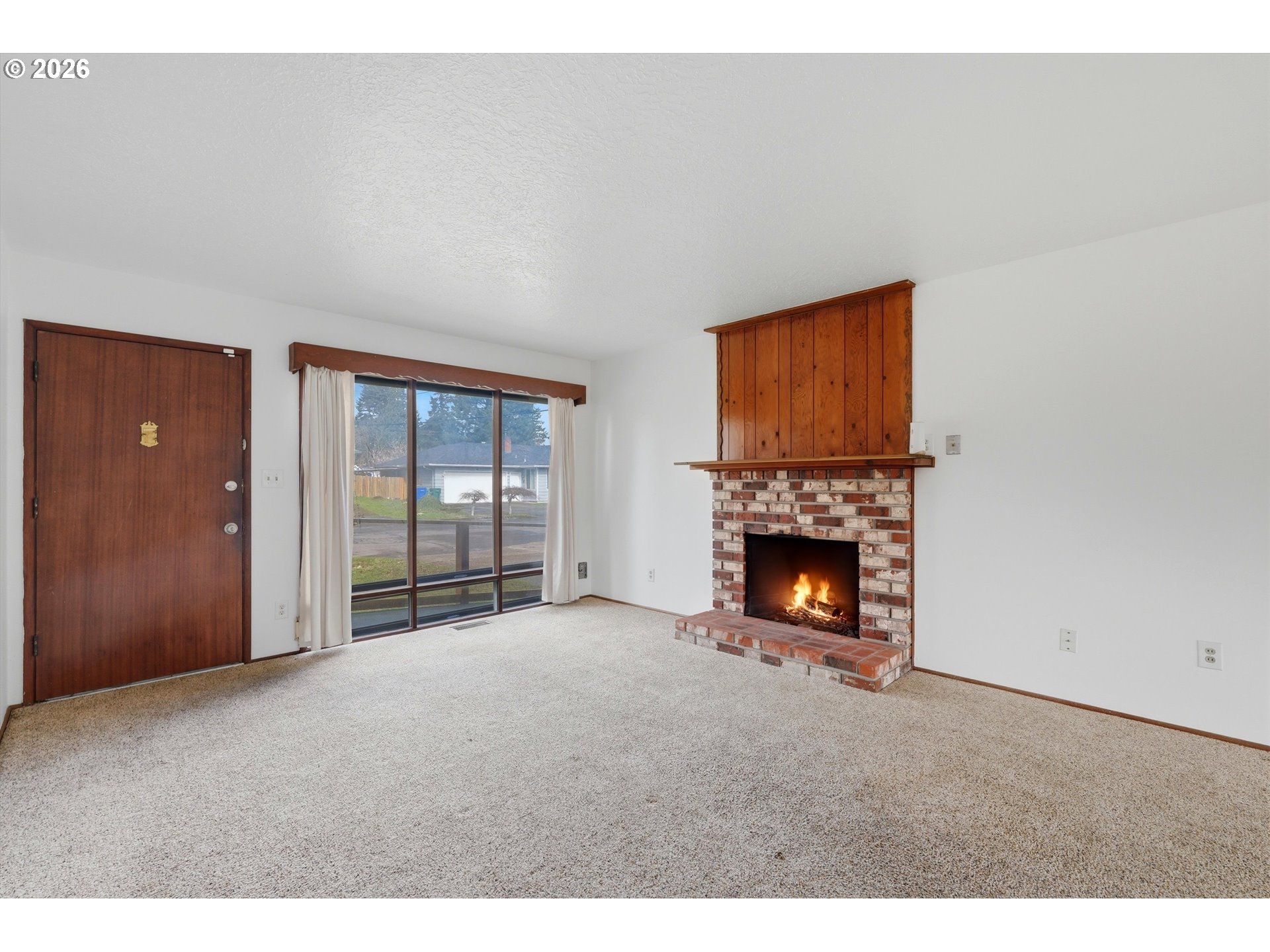 16706 Southeast Ankeny Street Portland, OR 97233 - Photo 6 of 43 a view of an empty room with a fireplace