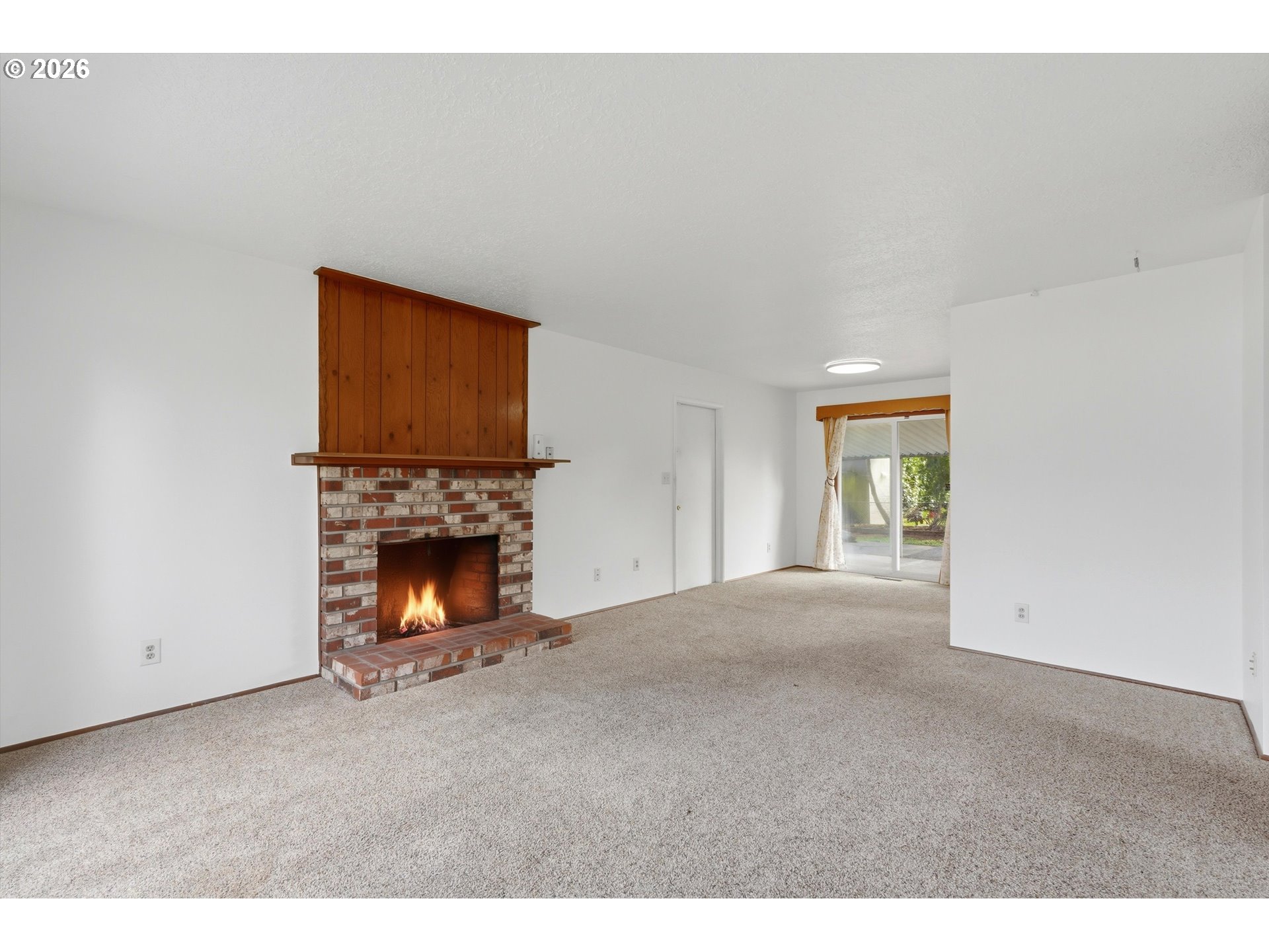16706 Southeast Ankeny Street Portland, OR 97233 - Photo 7 of 43 a view of a livingroom with a fireplace