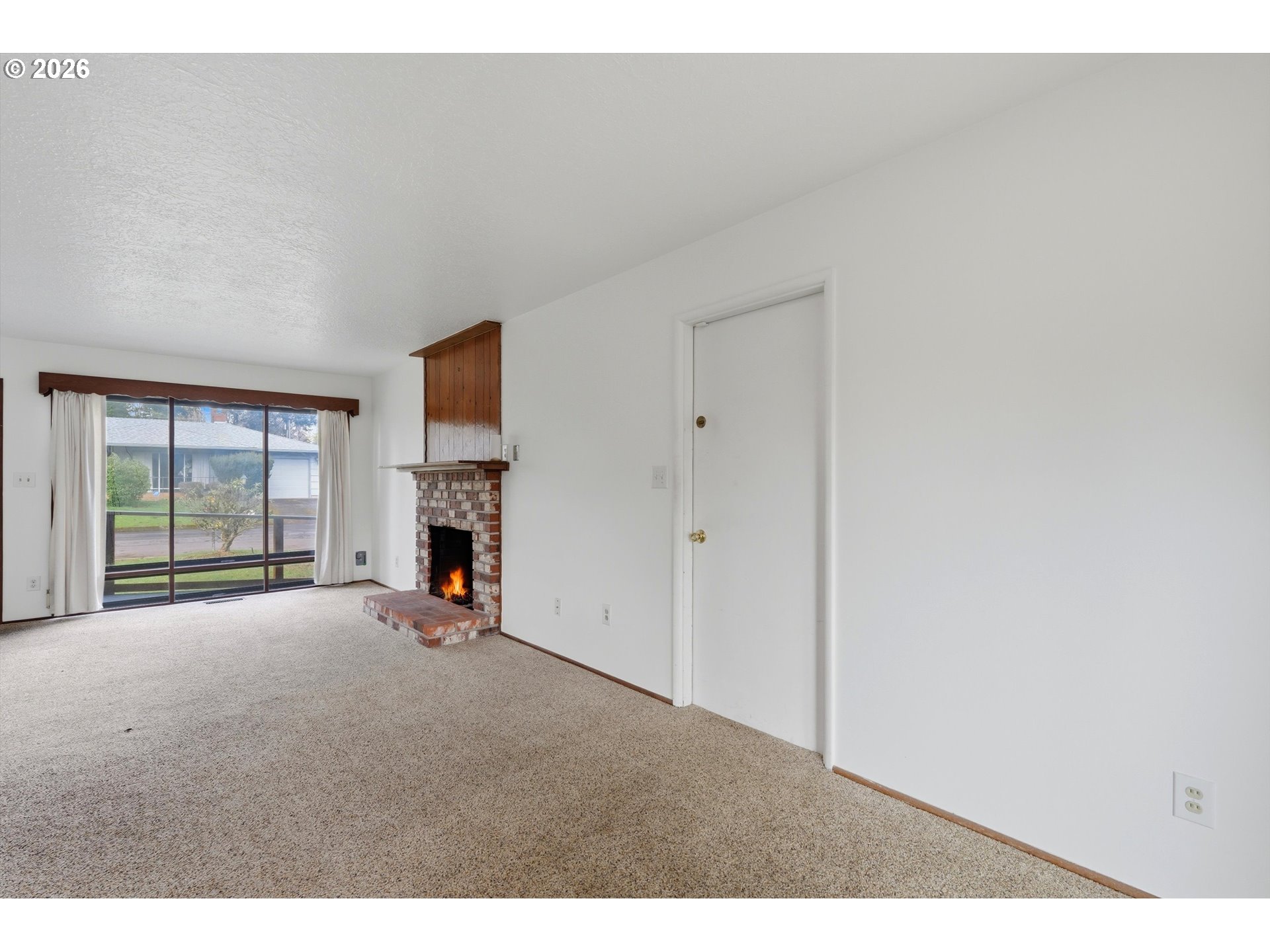 16706 Southeast Ankeny Street Portland, OR 97233 - Photo 9 of 43 a view of empty room with windows and fireplace
