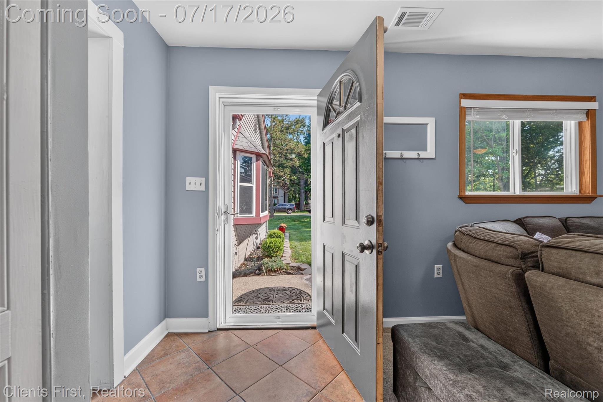 36852 Chase Street Romulus, MI 48174 - Photo 3 of 40 Entryway with terracotta-style tile flooring and a light blue wall finish