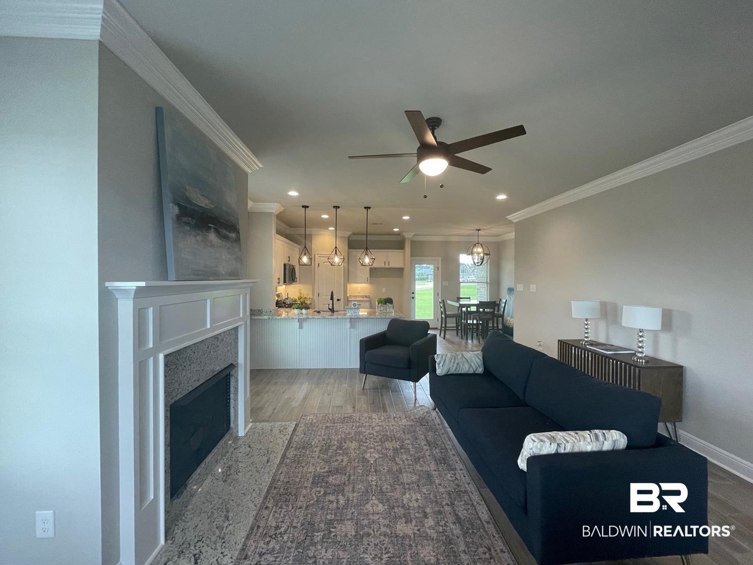 9961 Chipper Lane Foley, AL 36535 - Photo 4 of 16 Living room with sink, ceiling fan, hardwood / wood-style flooring, and ornamental molding