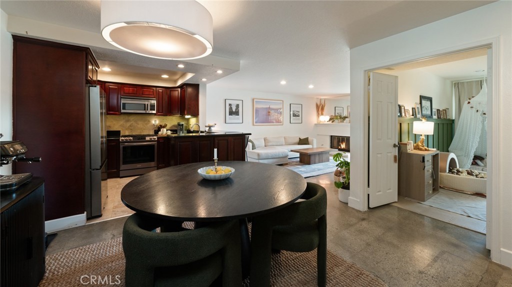 a kitchen with a table and chairs