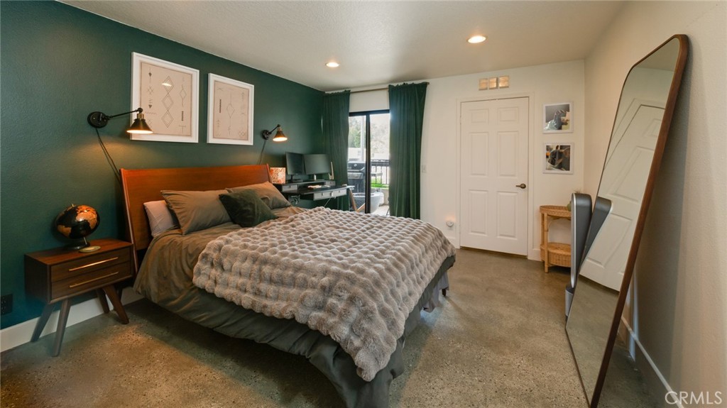 8512 Tuscany Avenue, Unit 222 Playa del Rey, CA 90293 - Photo 12 of 24 a bedroom with a bed and a large mirror