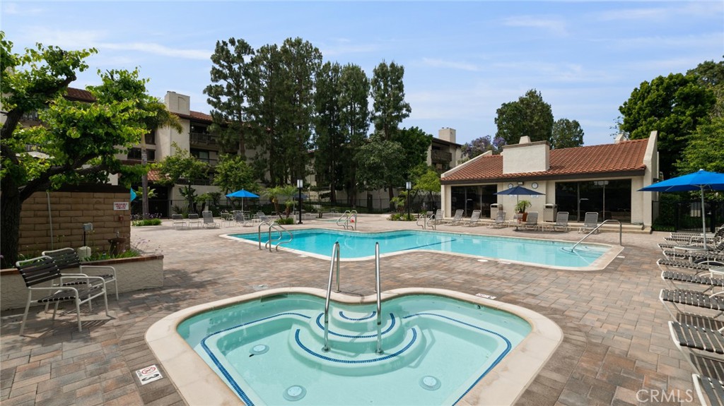 8512 Tuscany Avenue, Unit 222 Playa del Rey, CA 90293 - Photo 21 of 24 a swimming pool with outdoor seating yard and barbeque oven