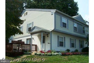 20 Ridgelawn Road, Unit B Reisterstown, MD 21136 - Photo 1 of 11 a front view of a house with a yard