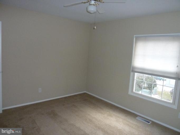 20 Ridgelawn Road, Unit B Reisterstown, MD 21136 - Photo 4 of 11 an empty room with a window