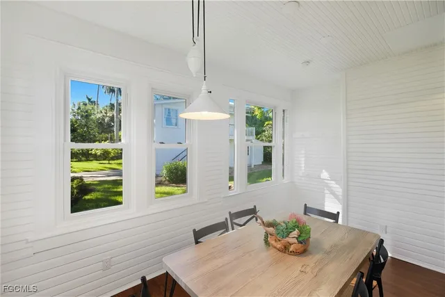 a view of a dining room with furniture and window