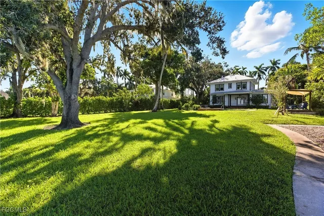 a view of a house with a big yard