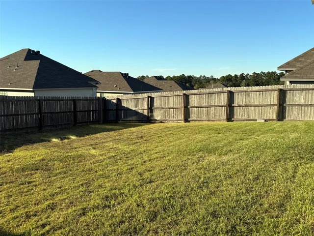 a house view with a backyard space