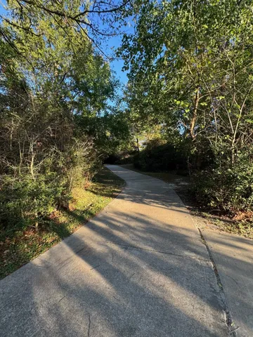 a view of swimming pool with an outdoor space and seating area