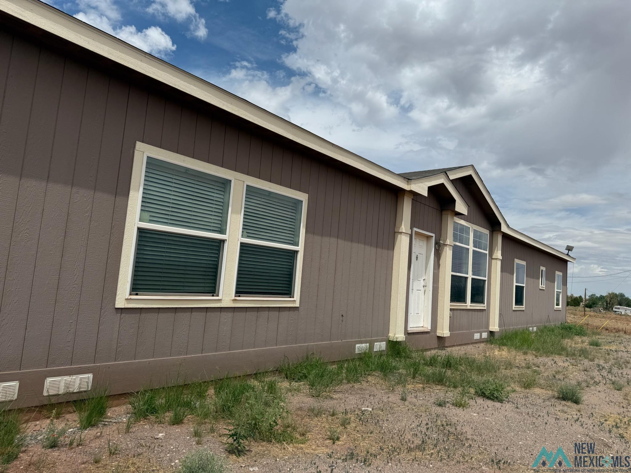 118 Robert's Road Bluewater, NM 87005 - Photo 1 of 1 Property entrance with crawl space