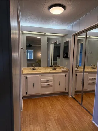 a view of bathroom with dual sinks