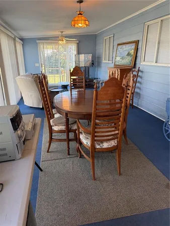 a view of a livingroom with furniture and window