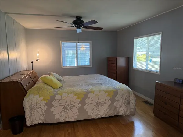 a bedroom with a bed and window