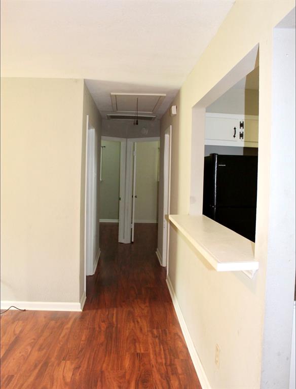 100 Hickory Road Lone Oak, TX 75453 - Photo 14 of 30 a view of a hallway with wooden floor