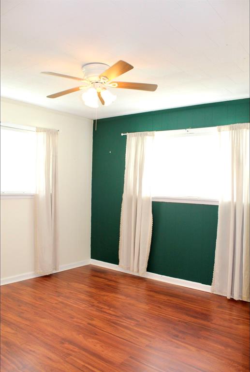 100 Hickory Road Lone Oak, TX 75453 - Photo 15 of 30 a view of a room with wooden floor and a window