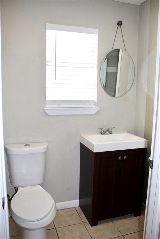 100 Hickory Road Lone Oak, TX 75453 - Photo 20 of 30 a bathroom with a toilet sink and mirror