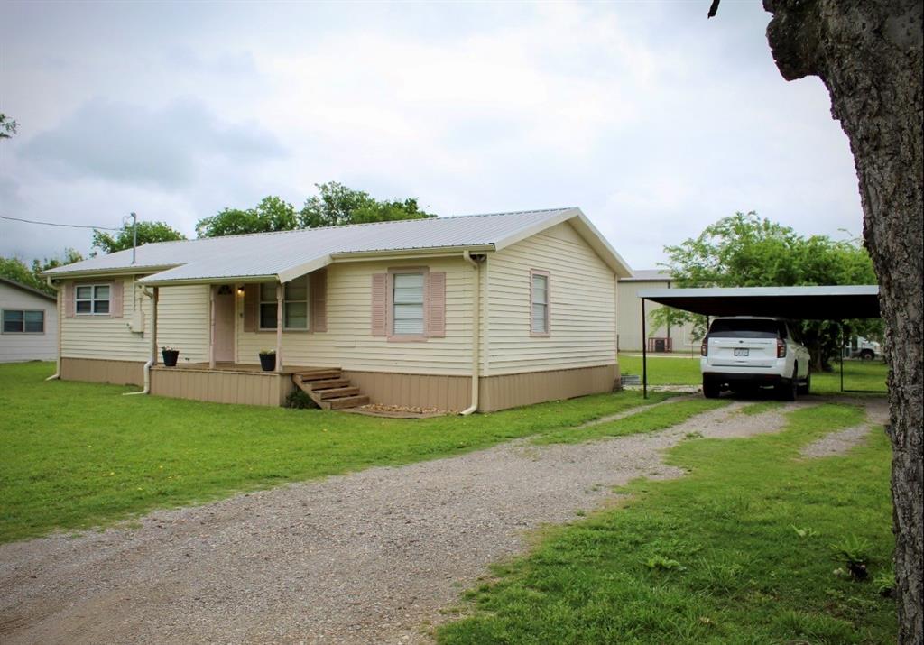 100 Hickory Road Lone Oak, TX 75453 - Photo 2 of 30 a view of a house with backyard
