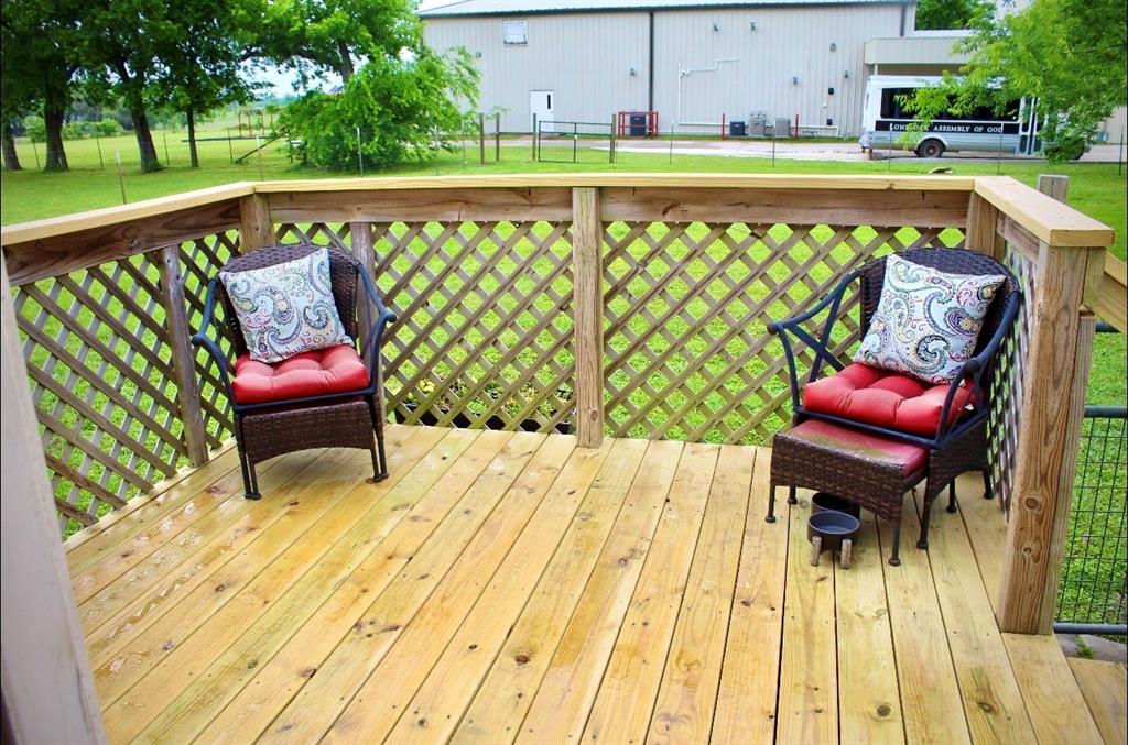 100 Hickory Road Lone Oak, TX 75453 - Photo 22 of 30 a balcony with wooden floor table and chairs