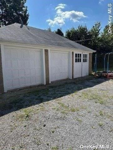59 Radnor Road Great Neck, NY 11023 - Photo 14 of 15 a view of a house with a yard