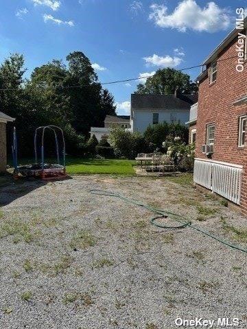 59 Radnor Road Great Neck, NY 11023 - Photo 15 of 15 a view of a park with swings and slides