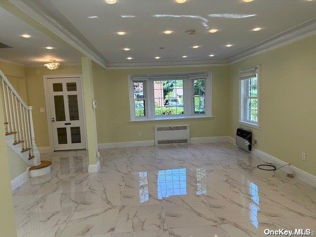 59 Radnor Road Great Neck, NY 11023 - Photo 3 of 15 a view of an empty room with a window
