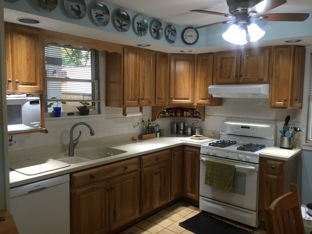 2011 Spruce Road Homewood, IL 60430 - Photo 10 of 25 a kitchen with stainless steel appliances granite countertop a sink a stove and cabinets