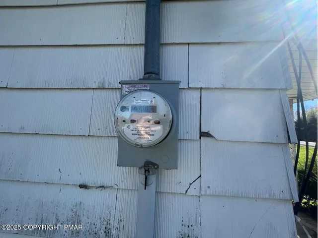 a bathroom with a sink and mirror with bathtub