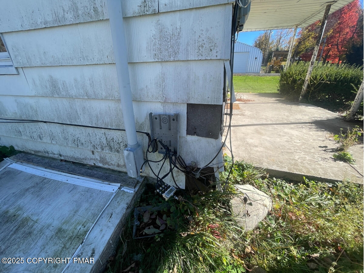1900 Greenfield Road Jermyn, PA 18433 - Photo 18 of 86 a view of a chair and table in the back yard of the house