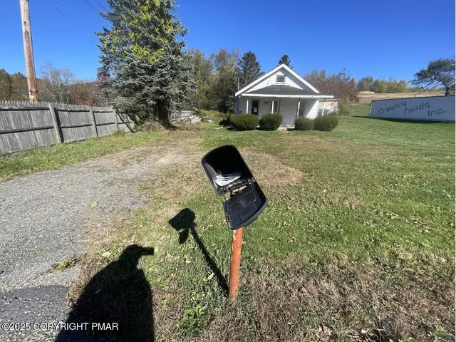 a view of a back yard of the house