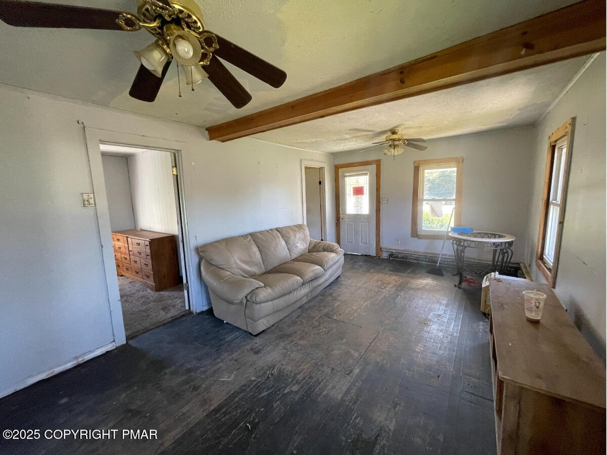 1900 Greenfield Road Jermyn, PA 18433 - Photo 27 of 86 a living room with furniture and a chandelier