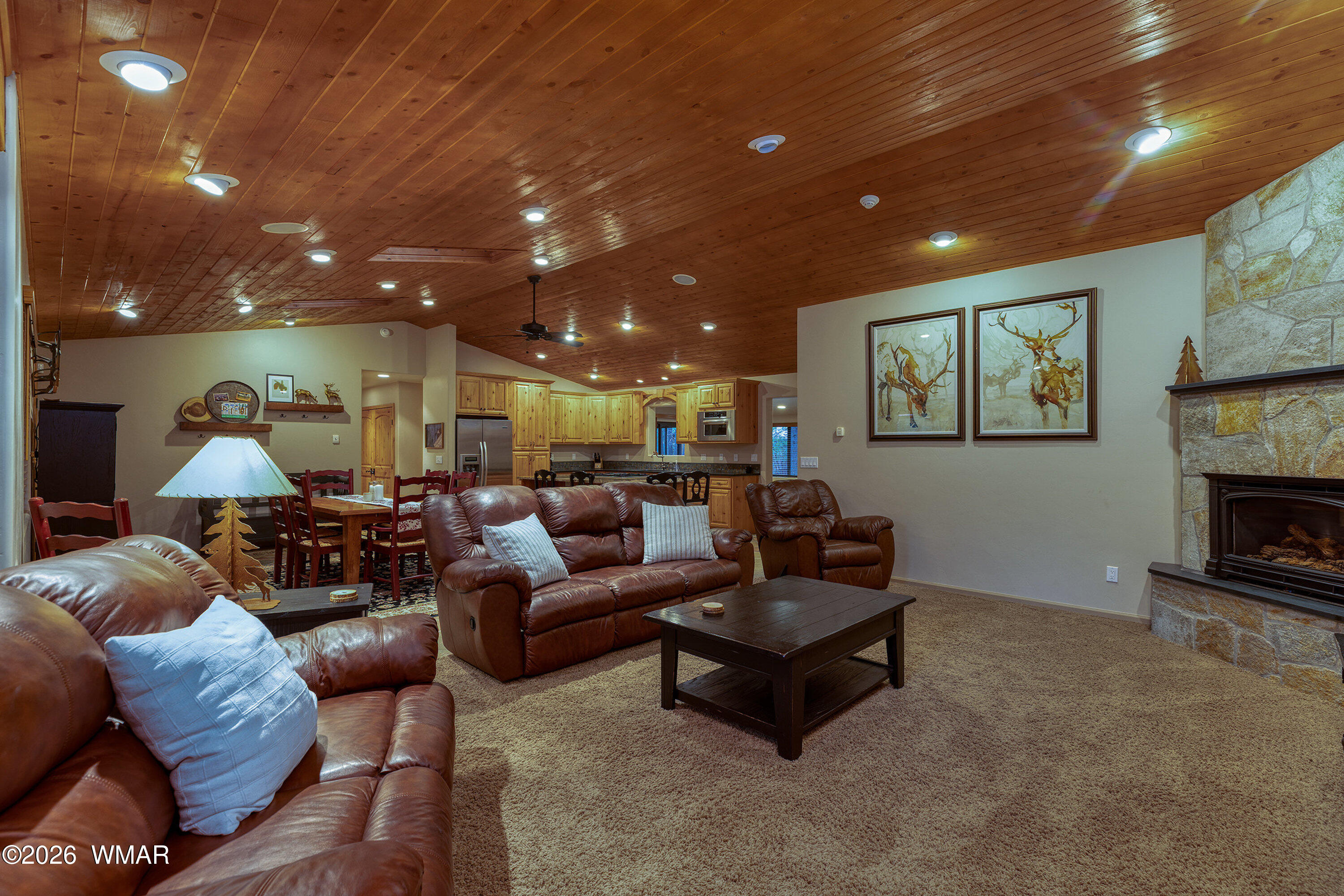 5155 Buck Springs Road Pinetop, AZ 85935 - Photo 13 of 37 a living room with furniture and a fireplace