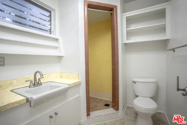 a bathroom with a sink and a toilet