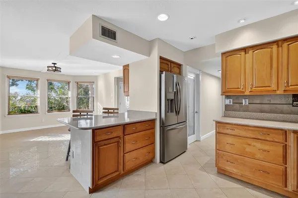 a kitchen with stainless steel appliances granite countertop a stove and a sink