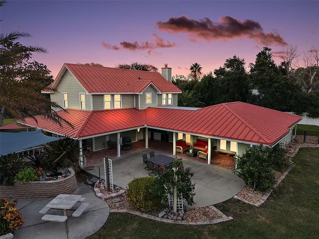 a front view of a house with garden space and street view