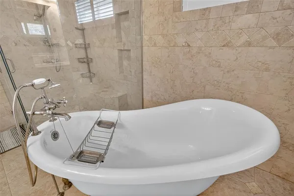 a view of a house with a backyard porch and sitting area