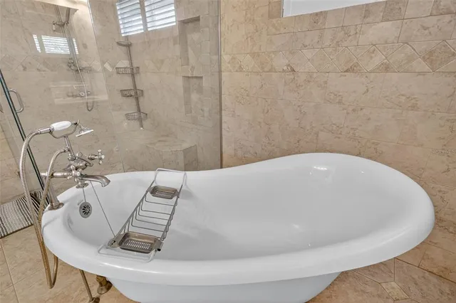 a view of a house with a backyard porch and sitting area