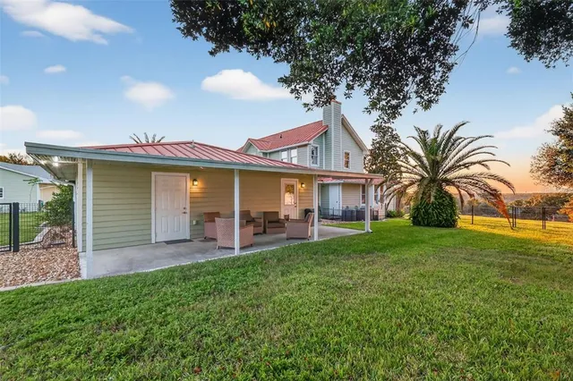 a view of a livingroom with a ceiling fan and window