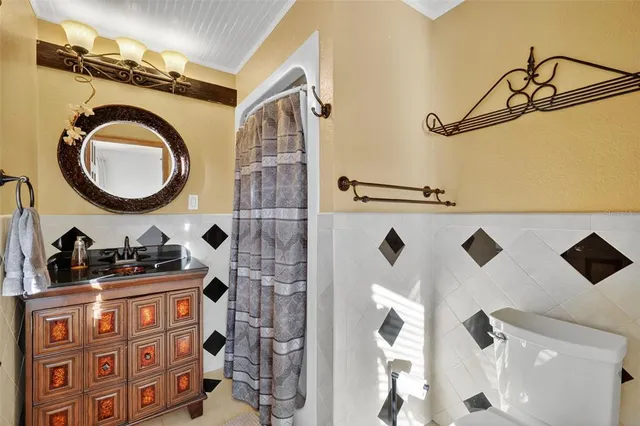a view of a dinning table and chairs in patio of the house