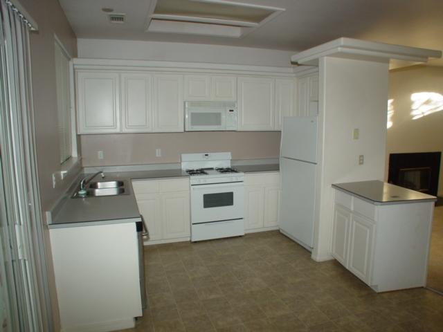 3345 Lawrence Road Redding, CA 96002 - Photo 3 of 5 a kitchen with a stove and a refrigerator