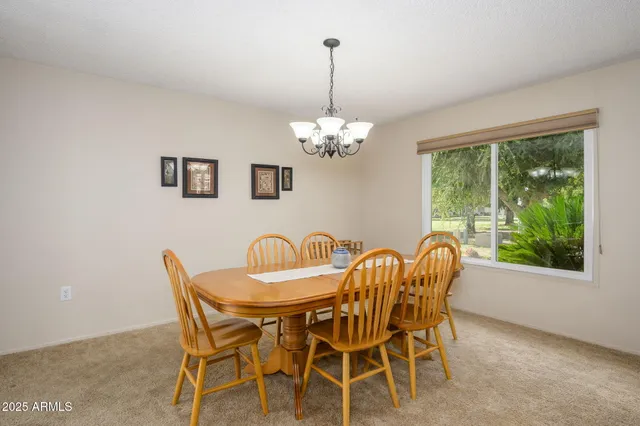 a dining room with furniture and window