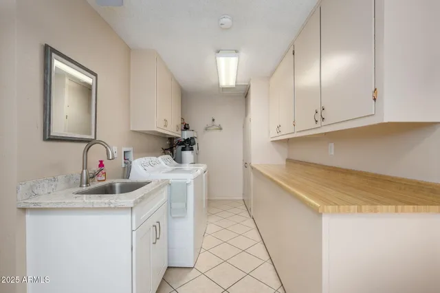 a kitchen with a sink and cabinets