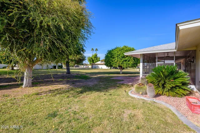 a view of backyard with green space