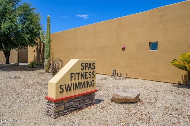 a sign that is on a brick wall