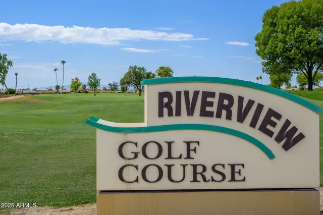 a view of a swimming pool with an outdoor space and seating area
